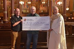 Knights donate for Cathedral lights