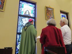 New stained glass window completes Holy Family's panel