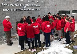 Utah Catholic students pray during the National School Walk Out 
