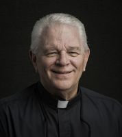 Fr. John J. Schwall presented with Christ the Teacher award