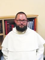 Two priests departing St. Catherine of Siena Newman Center
