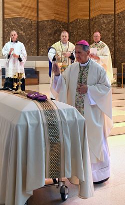 At funeral Mass, Father Michael Buckley recalled as a priest who embraced his cross